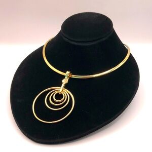 Elegant Gold-Tone Torque Necklace with RMN Multi Rings Enhancer Pendant